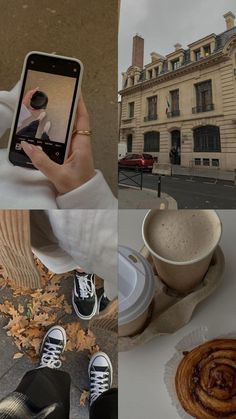 a person holding up a cell phone in front of a cup of coffee and cinnamon roll