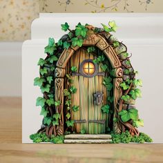 a card with an image of a green door in the shape of a tree house