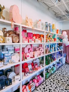 a room filled with lots of different types of hats and other items on shelving