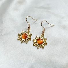 Make this Golden Hour Sun Earrings a part of your aesthetic outfit ✨ Sun Earrings Aesthetic, 70s Inspired Jewelry, 70s Style Jewelry, Orange Earrings Aesthetic, Earings Aesthetics, 70s Accessories Jewelry, Sun Outfits, Good Earrings, Orange Clothes