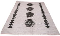 a rug with black and white designs on it