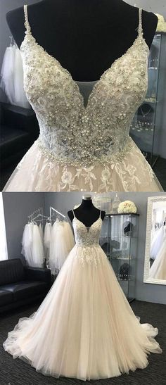 a white wedding dress on display in front of a mirror