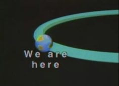 a screen with the words we are here on it and a small globe in the center