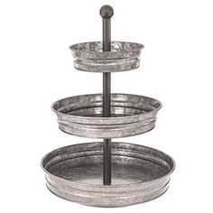 three tiered metal trays with handles on each side and an iron rod in the middle