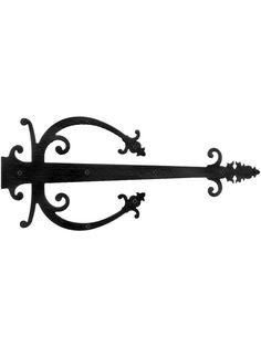 an ornate iron shelf bracket on a white background