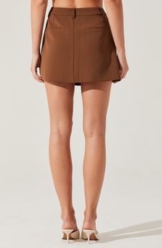 Trouser touches tailor a staple A-line skirt cut to a leggy mini length. 15" length (size Medium) Zip fly with hook-and-bar closure Front slant pockets; back welt pockets Lined 100% polyester Dry clean Imported Relaxed Mini Skort With Built-in Shorts, Elegant Mini Skirt With Built-in Shorts For Work, Chic Mini-length Bottoms For Date Night, Chic Mini Bottoms For Date Night, Date Night Lined Mini Skirt, Fitted Short Skort For Fall, Fitted Mini Length Bottoms With Belt Loops, Spring Mini Skirt For Date Night, Chic Above Knee Mini Skirt