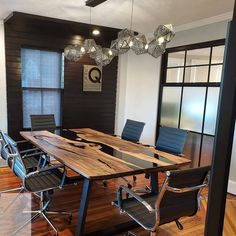 an empty conference room with wooden tables and chairs