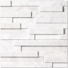 a white marble tile wall with lines on it