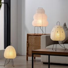 two lamps sitting next to each other in a living room