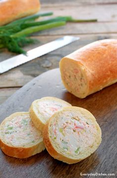 there are three pieces of bread on the cutting board