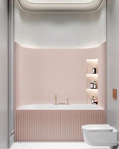 a bathroom with pink walls and white fixtures