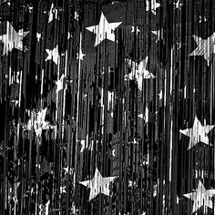 an american flag made out of stars is shown in black and gold foiled paper