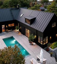 an aerial view of a house with a swimming pool