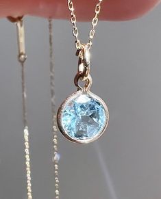 Wonderful natural aquamarine set in solid  14k yellow gold setting.  The gemstone sparkles beautifully and has a very good cut.  VVS clarity! This genuine aquamarine measures 4mm and weighs 0.60 carat. Total pendant weight is 0.35 grams Pendant length (including jump ring) - 15 mm *chain is not included The item shown in the photos is the exact item you will receive upon purchase. Double check dimensions and weight of item to make sure it meets your specifications before ordering. Each piece has Aquamarine Pendant, March Birthstone, Yellow Gold Setting, Natural Aquamarine, March Birth Stone, Pendant Set, Jump Rings, Necklace Bracelet, Charm Necklace