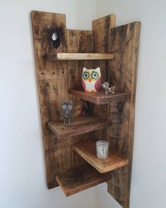 the shelves are made out of wood and have owl figurines on them