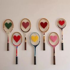 six different types of tennis rackets with hearts on them