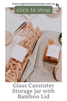 the glass canister storage jar with bamboo lid is shown in front of a table