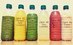 six plastic bottles with different types of juice in them, all labeled on the same label