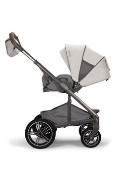 a baby stroller with an umbrella attached to the handle and seat, on a white background