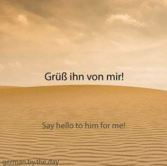 a person standing on top of a sand dune with the words gruisf in ven mir say hello to him for me