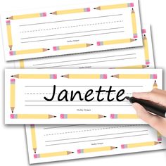 two pencils with name tags on them and one has the word janette written on it