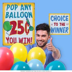 a man giving the thumbs up in front of balloons and signs that say, pop any balloon 25 to the winner