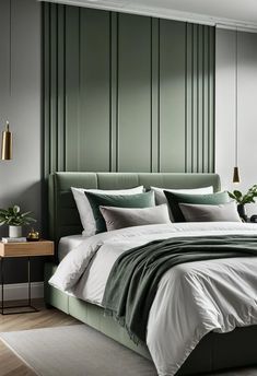 a large bed sitting in a bedroom next to a wall with green stripes on it