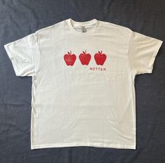 Hand printed rotten apple t-shirt All graphics are designed by me and printed onto Gildan brand t-shirts These shirts are made to order Apple Outfits, Apple Clothes, Rotten Apple, Apple Shirt, Tiktok Art, Art Tshirt, Virtual Closet, Diy Shirt, Summer Tops