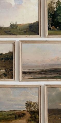 several paintings are hanging on the wall in front of each other, including sheep and trees