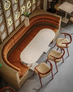 an overhead view of a table and chairs in a restaurant