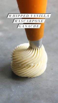 a close up of a person using a knife to make whipped vanilla mascarpone