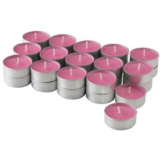 many pink candles are arranged in rows on a white surface with one candle lit up