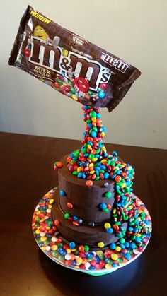 a chocolate cake topped with candy and sprinkles