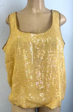 This sequin top is handmade, high quality, original design and beautiful. This top is suitable for party, events or any occasional use. Glamorous Stretch Top With Contrast Sequin, Sequin Stretch Blouse For Night Out, Stretch Sequined Blouse For Night Out, Festival Sleeveless Sequined Tops, Holiday Sequined Stretch Tops, Holiday Sequin Stretch Top, Sequin Stretch Tops For Holidays, Stretch Sequin Blouse For Party Season, Fitted Sequined Tank Top For Summer