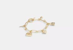 COACH® | Iconic Charm Chain Bracelet Coach Bracelets, Coach Jewelry, Charm Chain, Bracelet Online, Women Accessories Jewelry, Signature Style, You Bag, Chain Bracelet, Cubic Zirconia