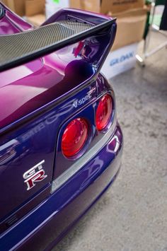 the back end of a purple sports car