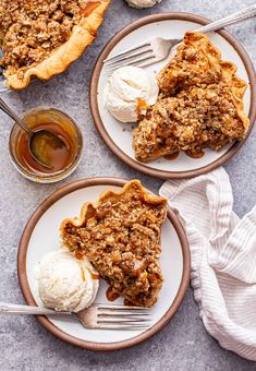 two plates with slices of pecan pie and ice cream