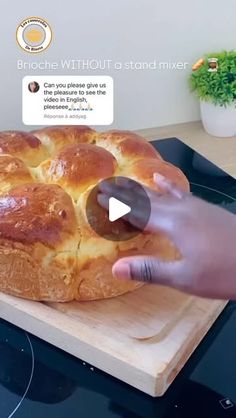 someone is placing a piece of bread on top of the stove to make it look like they are eating something