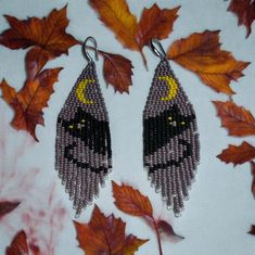 Introducing our exquisite Hand Beaded Purple Black Cat Earrings - a perfect blend of charm and elegance. Each earring features a meticulously crafted black cat, adorned with intricate purple beadwork that adds a touch of whimsy and sophistication. Made with high-quality materials, these earrings are lightweight and comfortable to wear, making them an ideal accessory for any cat lover or anyone looking to add a playful yet stylish touch to their outfit. Whether you're dressing up for a special oc Cat Geometric, Fall Moon, Black Cat Earrings, Earrings Fall, Cat Earrings, Earrings Black, Moon Earrings, Seed Bead Earrings, Geometric Earrings