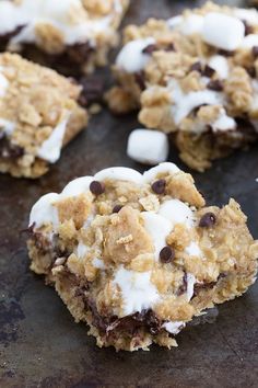 an oatmeal cookie with chocolate chips and marshmallows on top