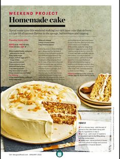 a cake with white frosting sitting on top of a table