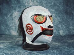 Semi-Pro Mask details This is a brand-new Luchador Mask.Made by a professional mask maker (Mascarero). Adult Size: 22.83 in = 7 1/4 (Cap size). Strong stitching inside the mask. Fabric made to last. Materials & Care We use high-quality materials in our Wrestling Masks, including: Hologram Lycra, Puntini Hologram, and Scale Dragon Fabrics. Fabric: Stretchable & Comfortable. Decorative Fabrics for an authentic Lucha Libre look. Care Instructions: Wash manually. Wash with cold water. Avoid excessiv Wwe Mask, Halloween Customs, Mask Maker, Mexican Wrestler, Semi Pro, Blue Demon, Jig Saw, Excessive Sweating, Custom Party