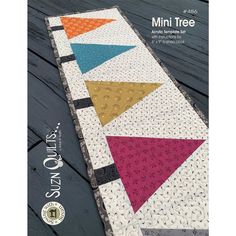 a book with an image of a colorful quilt on the cover