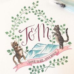 a drawing of two cats on top of a piece of paper with the word'fem love is all you need '