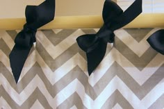 a curtain with black bows hanging from it's side and the words you can decorate your shower curtain with ribbons