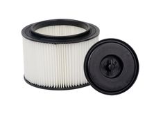 a black and white air filter next to a round plastic container on a white background