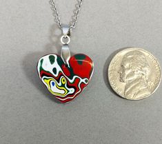 This fordite heart necklace is a great example of modern fordite. This piece is reversible with different colors on each side. The heart comes with a stainless steel bail and the pictured 20 inch stainless steel chain making it worry free jewelry. This fordite is from Ohio and occurred as a byproduct of painting parts for freightliners. This heart measures about 20 x 21 mm. Fordite is recycled automotive paint sourced from automotive factories as well as manufacturers who paint parts for new vehicles. It forms in thin layers as car parts are painted on the racks that hold them in place. After hundreds of trips through the booth where the paint is sprayed and then baked the excess buildup is scraped off the racks. We buy this waste paint in rough chunks and recycle it into beautiful jewelry Fordite Jewelry, Chain Heart, Chain Making, Automotive Paint, Vehicle Paint, Agate Pendant, Valentine Heart, Steel Chain, Free Jewelry