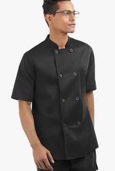 Now you see a spill – now you don’t! The reversible front closure on this Stretch Chef Coat handles messy situations in a flash. Short sleeves keep you cool. The relaxed fit is enhanced by a back vent. No matter the temperature of the oven or the pace of your kitchen, Chef 360 always gives you 360 degrees of movement and comfort • Relaxed fit • Stand collar • Double breasted • Reversible front closure • Buttons have ChefUniforms.com logo • Total of 2 pockets • 1 chest pocket • 1 pen/thermometer Chef Coats, Chef Uniforms, Asymmetrical Coat, Chef Shoes, Chef Shirts, Chef Pants, Men's Uniforms, Chef Uniform, Hospitality Uniform