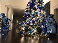 a christmas tree with blue and white decorations