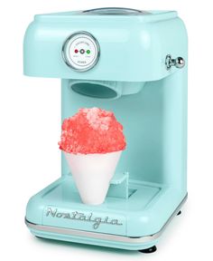 a small ice cream machine with red sprinkles on it's cone